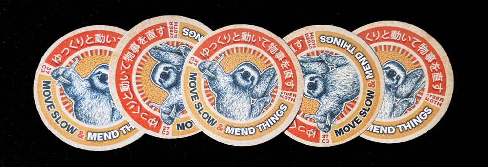 Five pieces of a circular sticker reading 